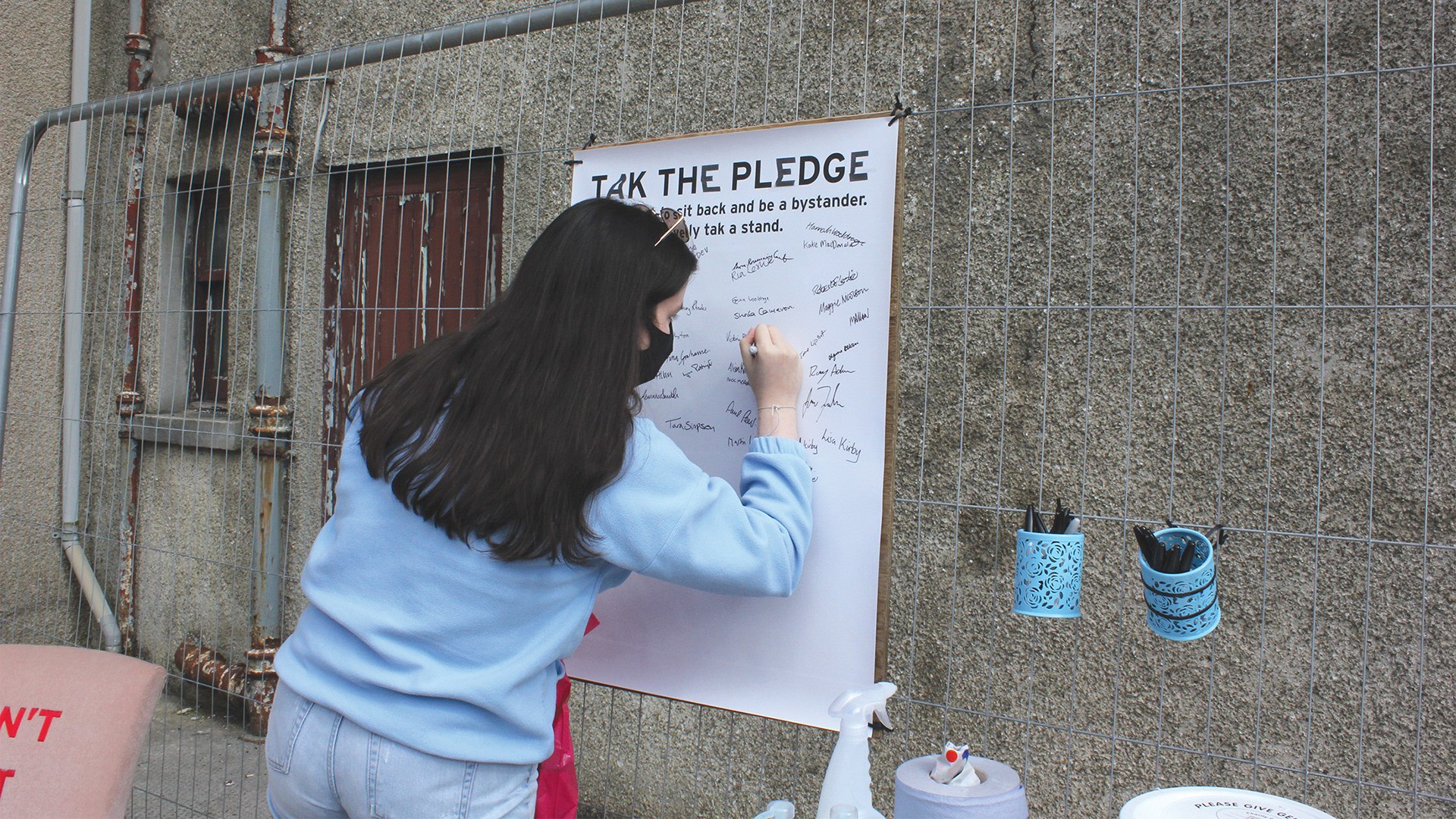 A temporary Tak A Stand exhibit urged people sign a pledge promising to call out sexual violence.