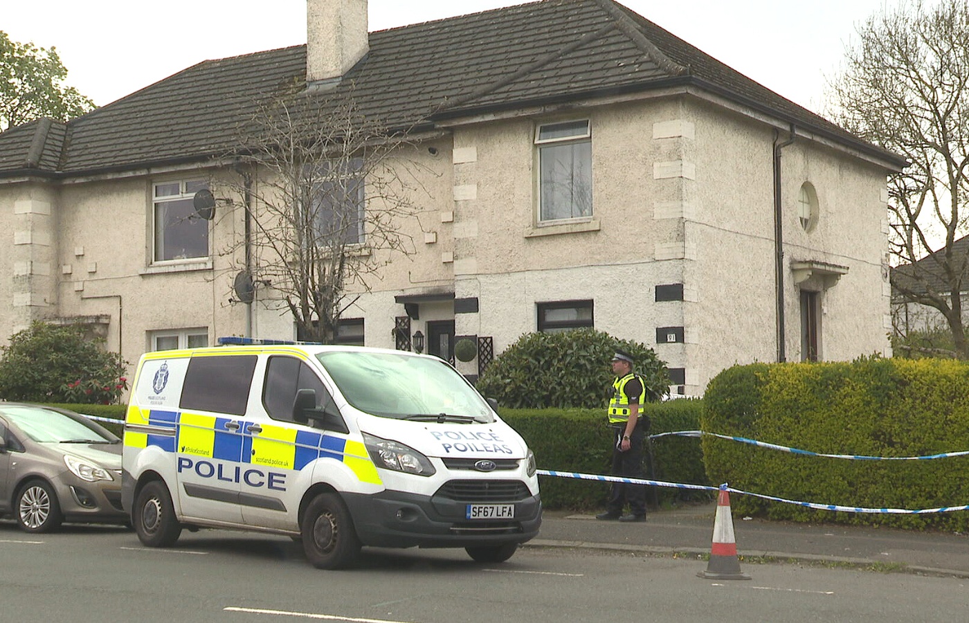 A police presence remains outside the address on Jura Street. 