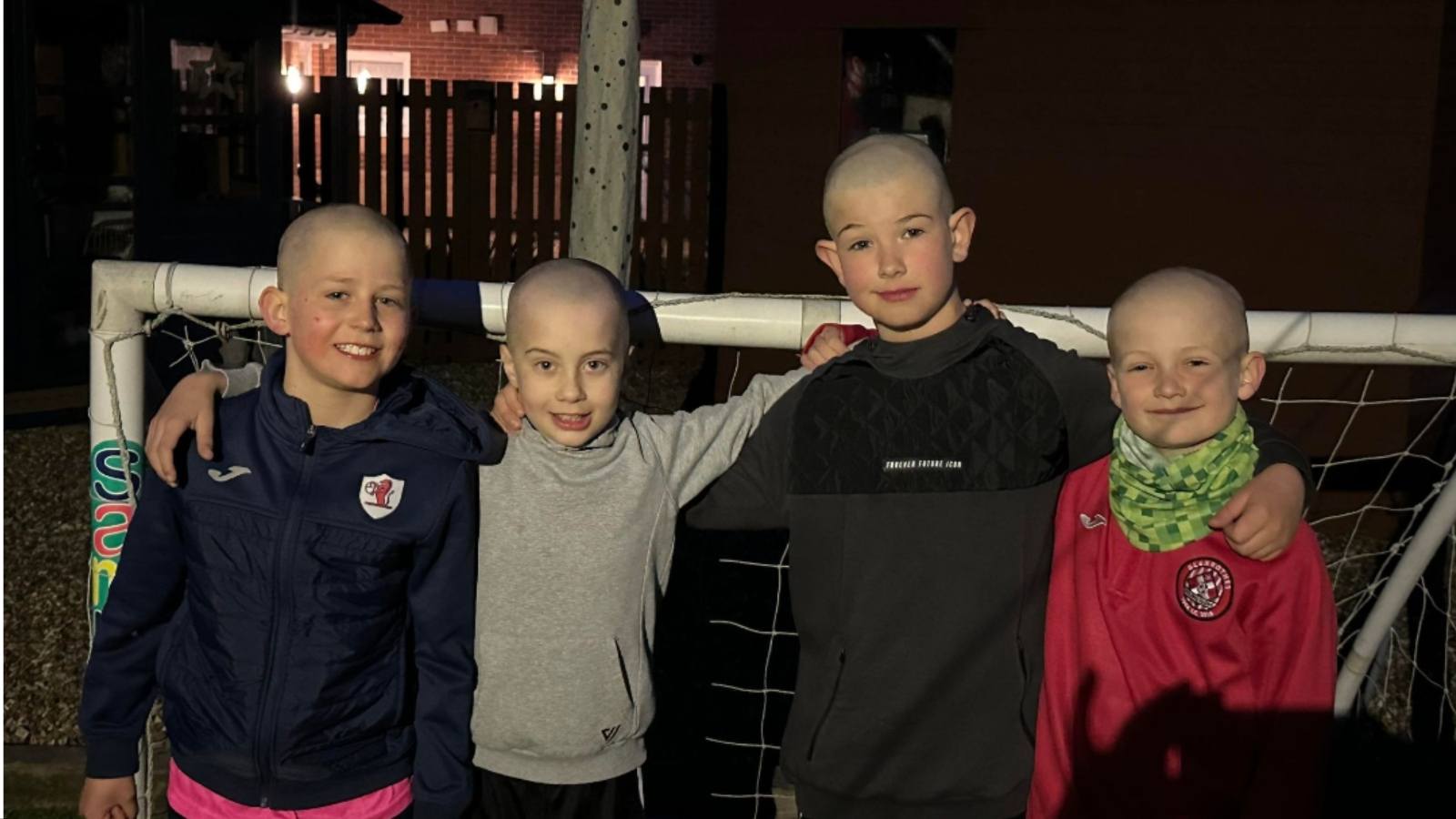 Archie (second from left) with the first of his friends to shave their heads Alexander Daly (left), Millar Maxwell and Findlay Spence (far right)