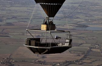 Red Bull BMX stunt rider Kriss Kyle from Stranraer defies gravity by performing tricks in hot air balloon