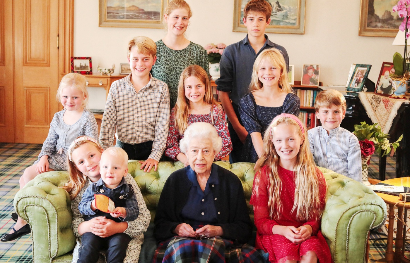 Photograph showing Queen Elizabeth with some of her grandchildren and great grandchildren at Balmoral.