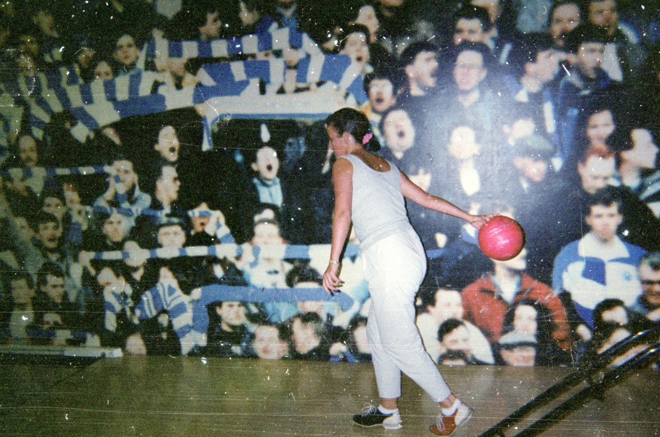 Images of the Kilmarnock stands at a football match adorn the walls. 