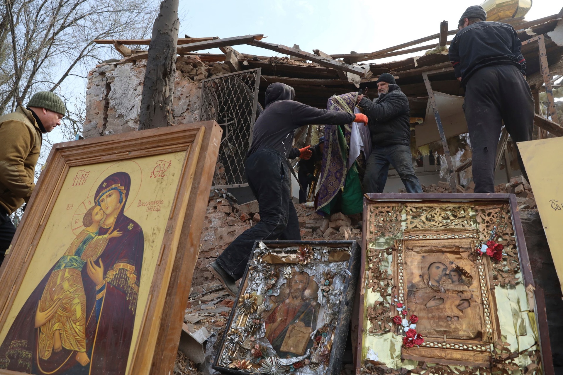 People save icons as they clear the rubble after a Russian rocket ruined an Orthodox church in rocket attack in Komyshuvakha, Zaporizhzhia region, Ukraine, in the early hours of Sunday (Kateryna Klochko/AP/PA)
