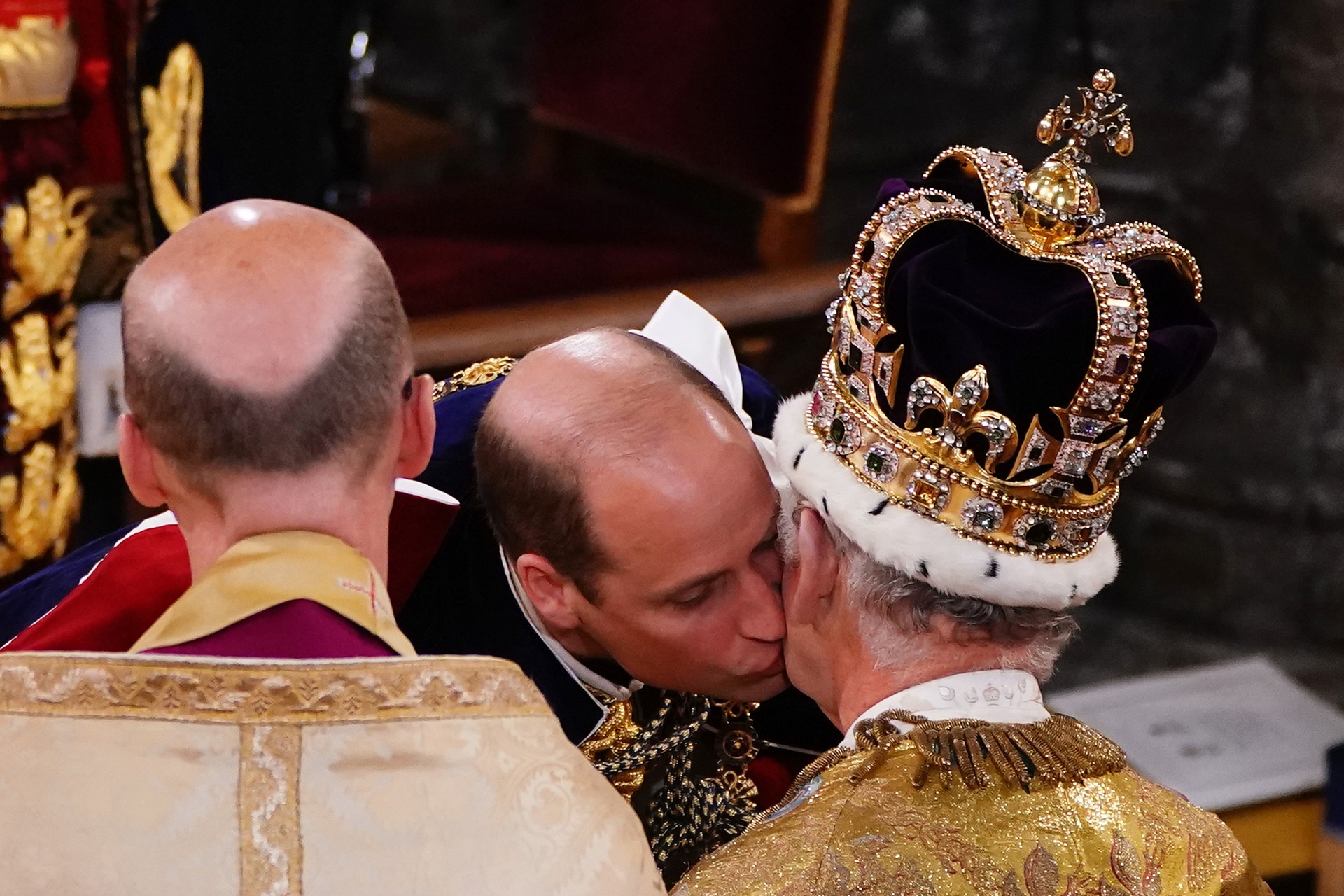 The Prince of Wales kisses his father King Charles III during his coronation ceremony in Westminster Abbey.