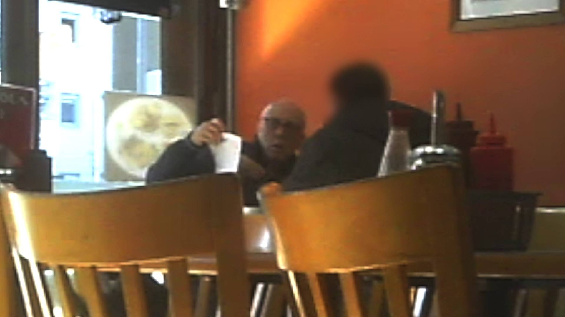 Beard meeting with an identity donor in a cafe in New Cross, London.