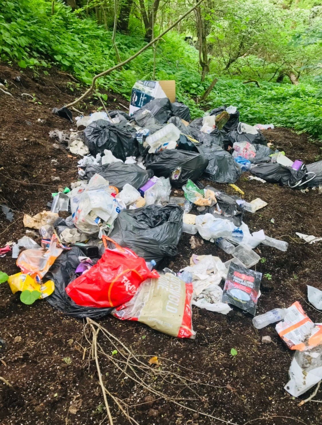 Fly-tipping in a rural location near the River Avon, Falkirk.