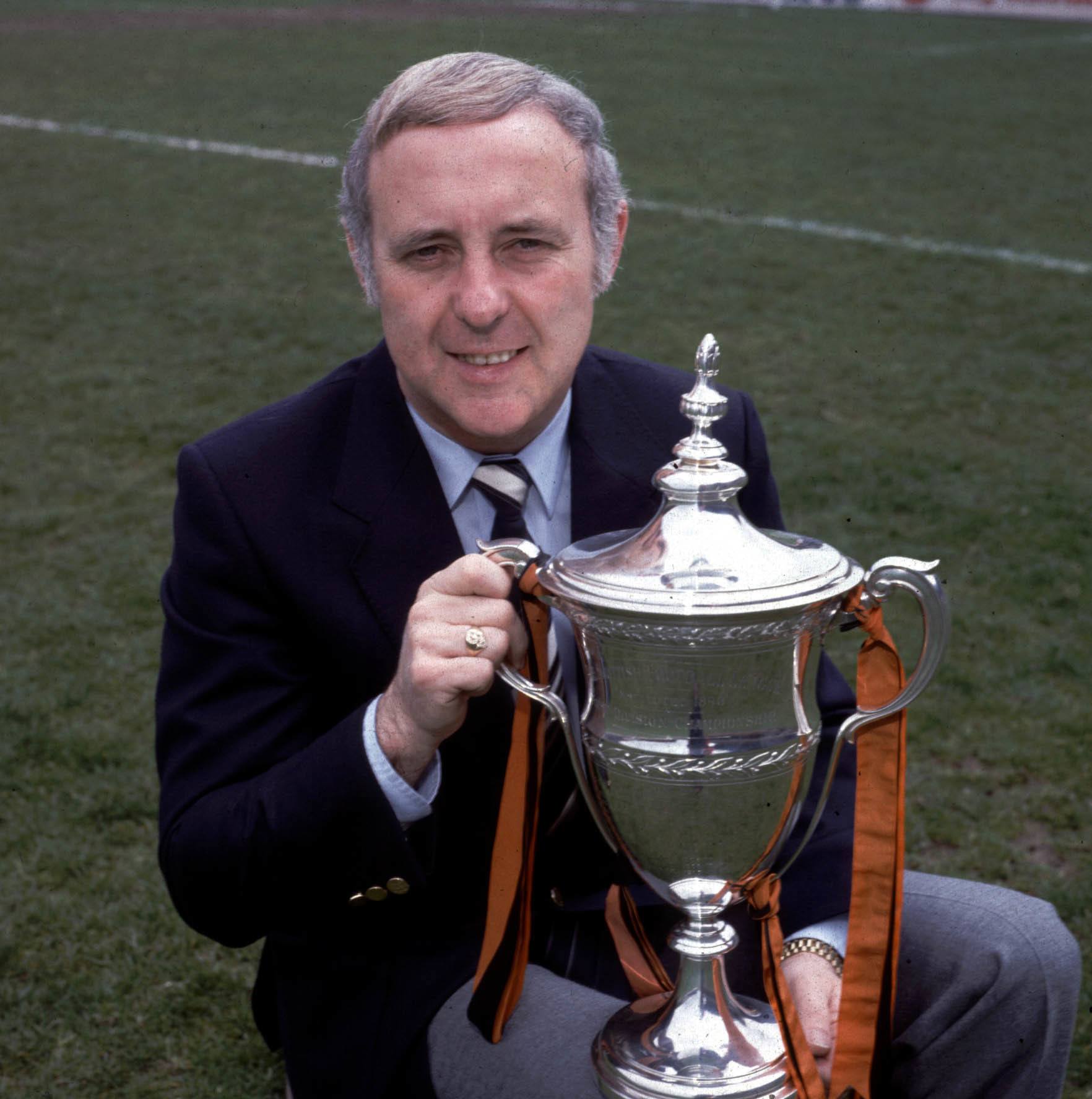 SEASON 1982/1983 Dundee United's manager, Jim McLean sits proudly with the Premier Division trophy which United won that season.