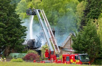 Dozens of firefighters tackling blaze in Moray as major road closed