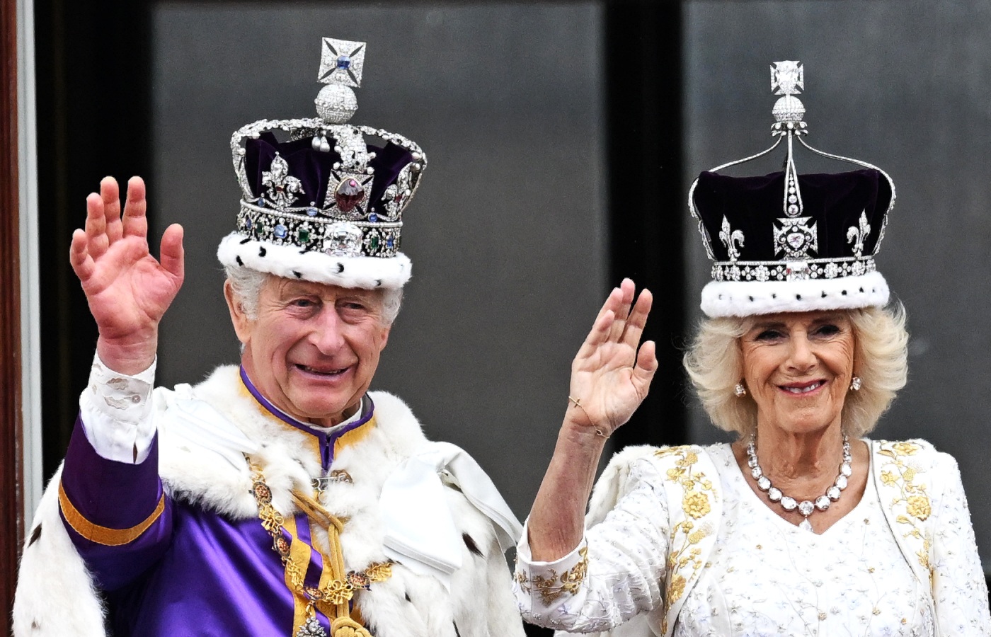 King Charles III and Queen Camilla waves from The Buckingham Palace balcony during the Coronation of King Charles III and Queen Camilla on May 6, 2023