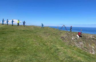 Dog stuck at bottom of cliff on golf course rescued by coastguard