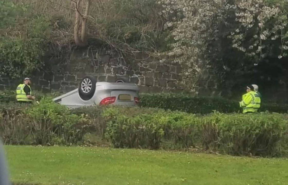 Person in hospital after car careers over wall and flips onto footpath in Inverkeithing, Fife