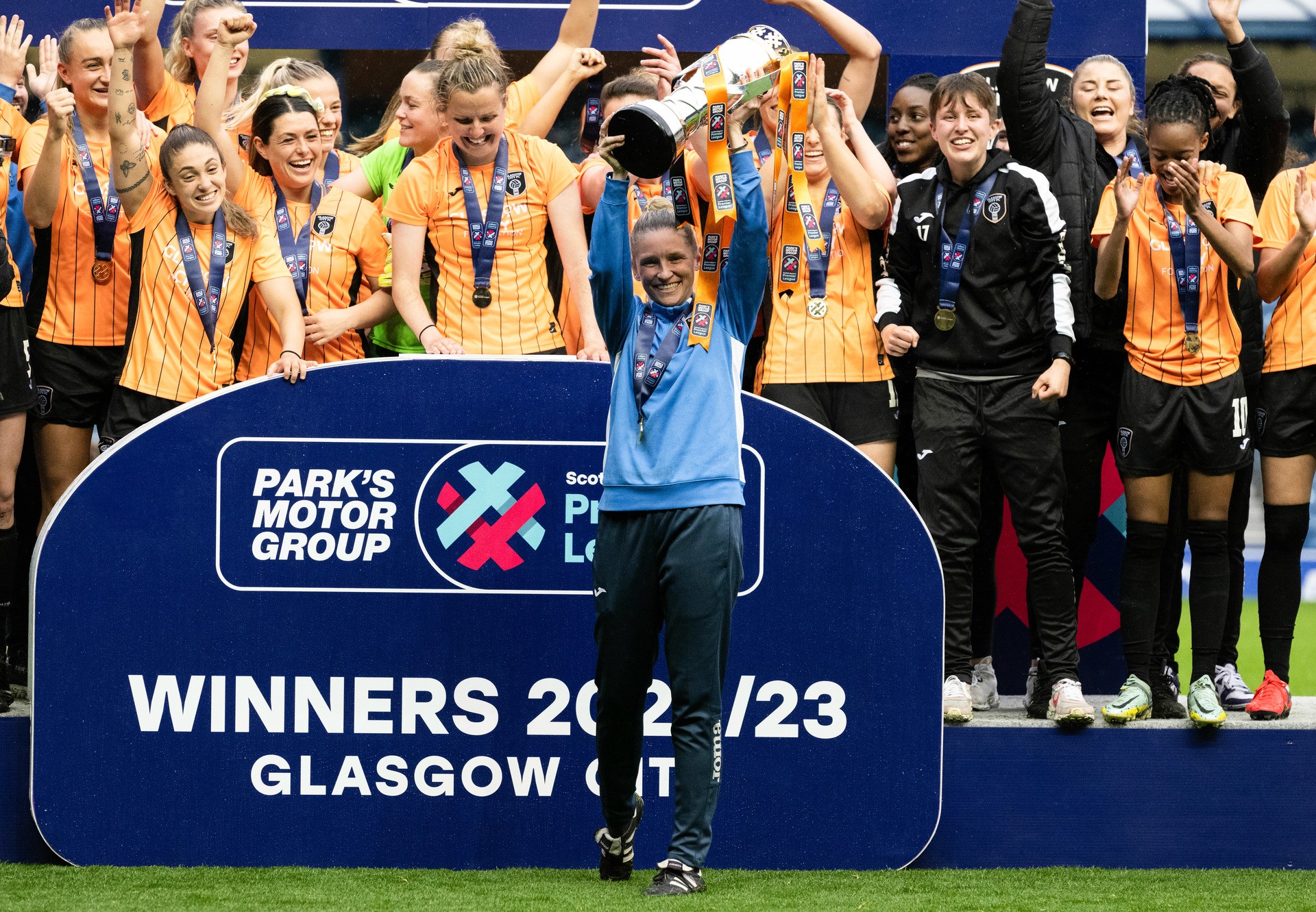 GLASGOW, SCOTLAND - MAY 21: Glasgow City Manager Leanne Ross lifts the league trophy during a Scottish Women's Premier League match between Rangers and Glasgow City  at Ibrox Stadium, on May 21, 2023, in Glasgow, Scotland.  (Photo by Paul Devlin / SNS Group)