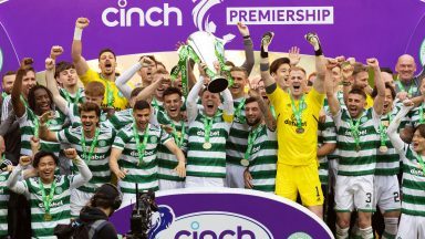 Celtic lift the Premiership trophy after thumping Aberdeen 5-0