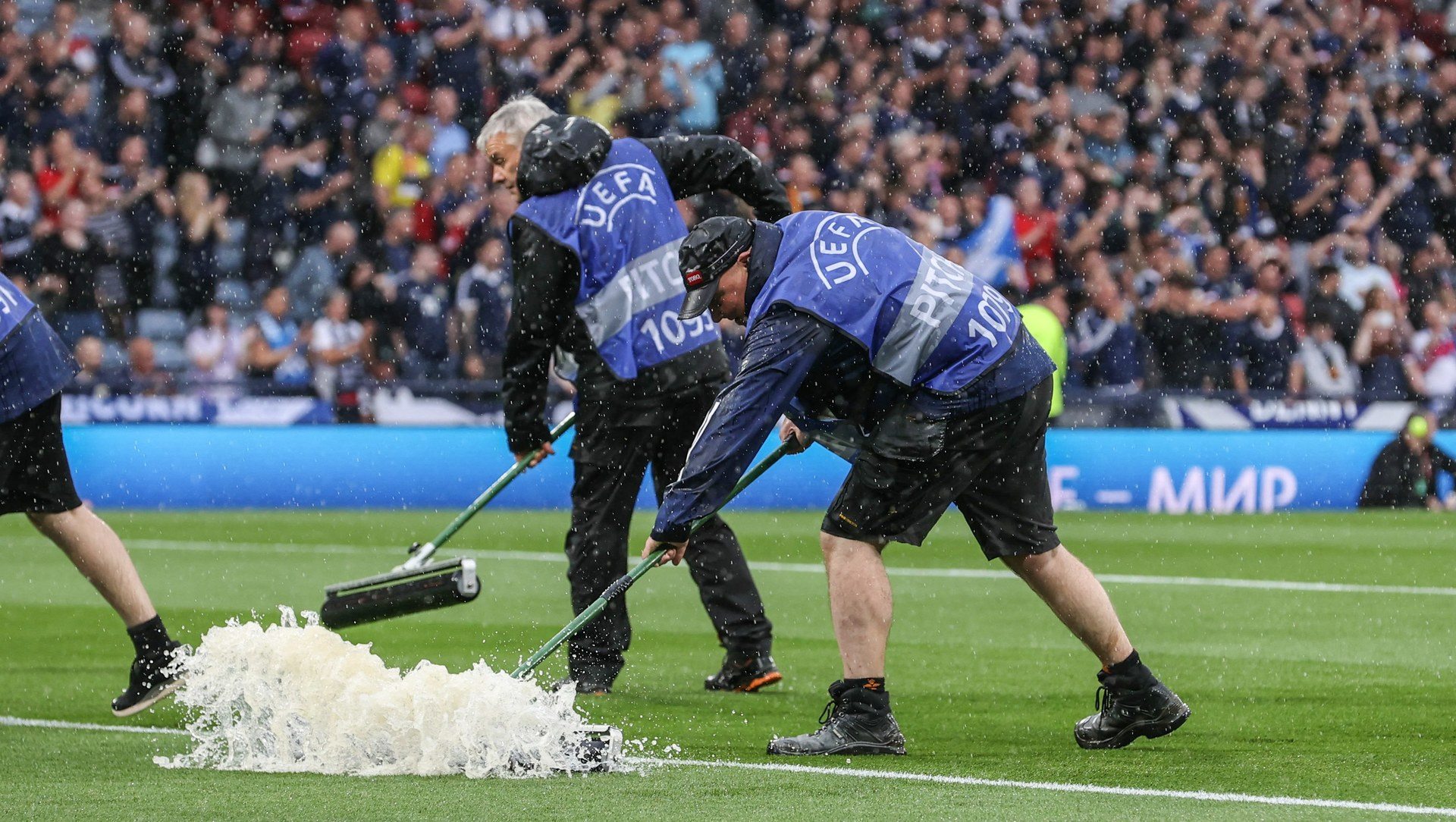 Scotland’s Euro 2024 qualifier against Georgia was suspended for over 90 minutes after torrential rain at Hampden flooded the pitch.