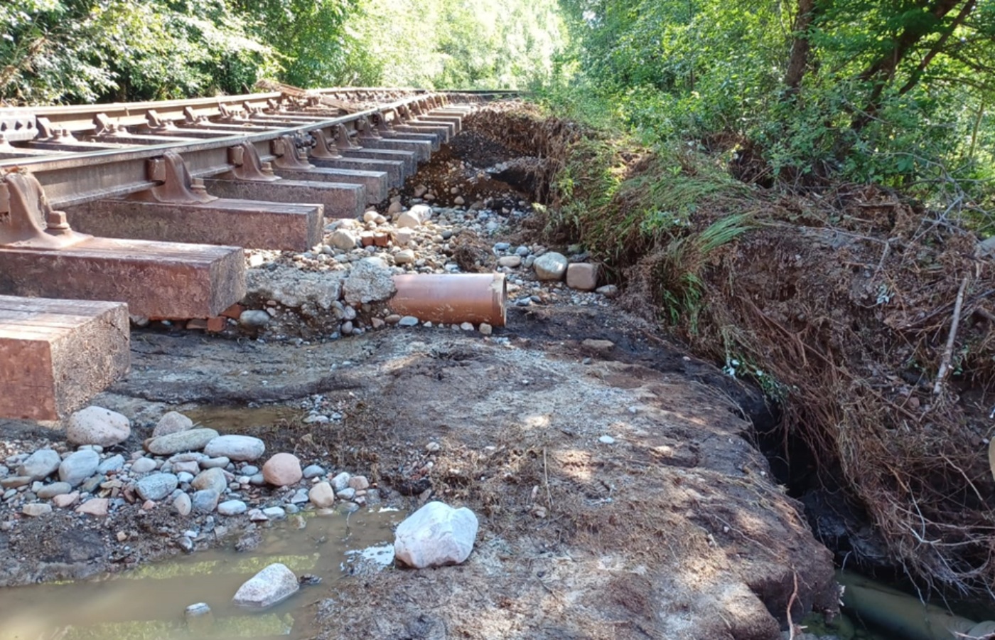 More than 400 tonnes of material had been washed away from under the track as a result of flash-flooding