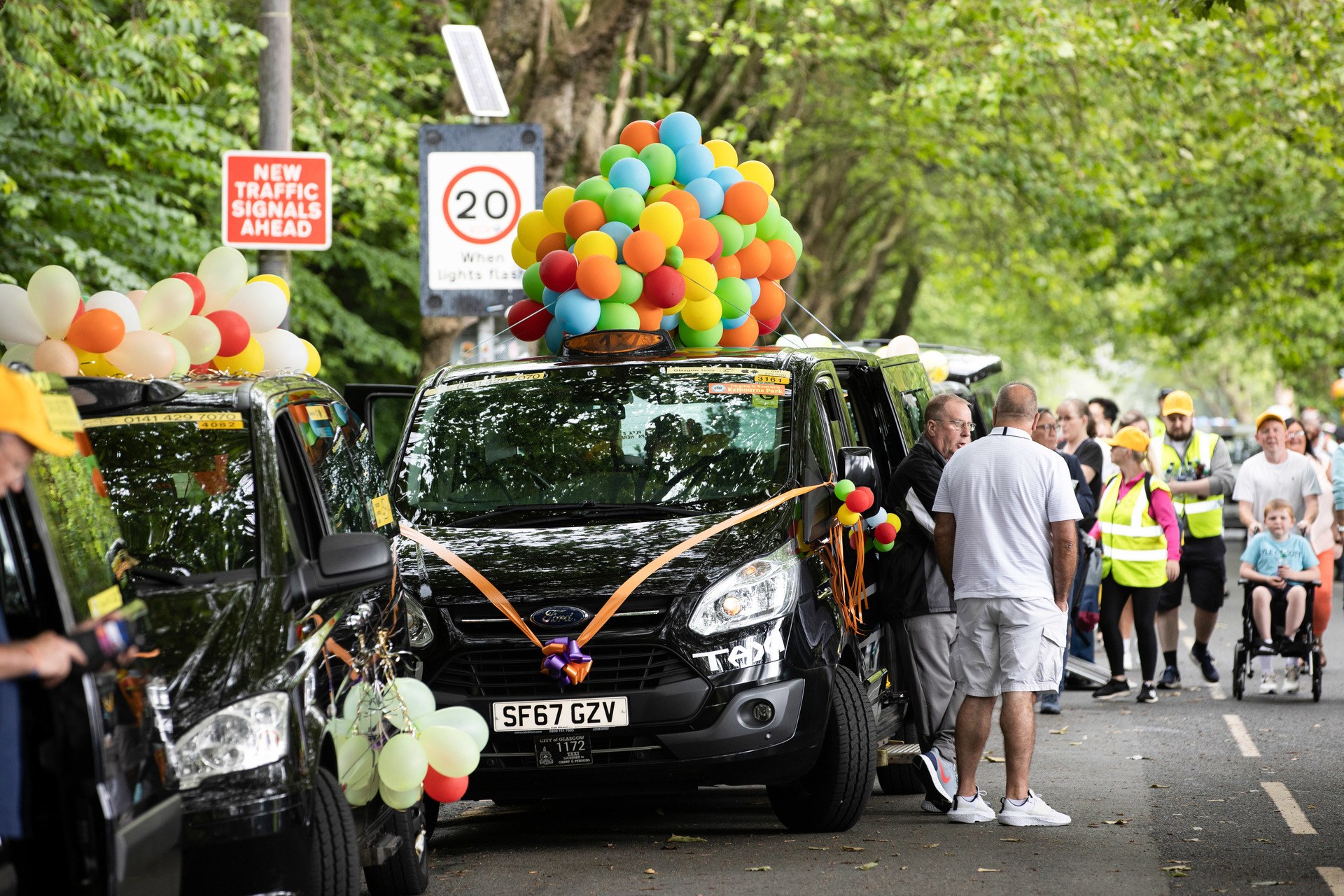 Colourful decorated taxis began the outing from Kelvin Way