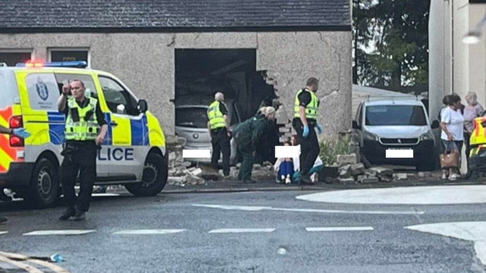 Car crashes into house as rescue crews tape off Glenrothes roundabout