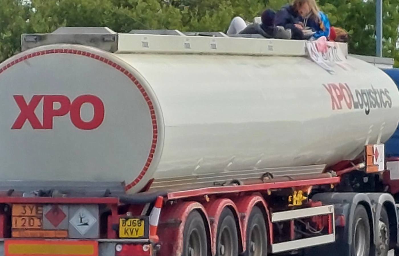 Protestors are climbing on top of tankers. 