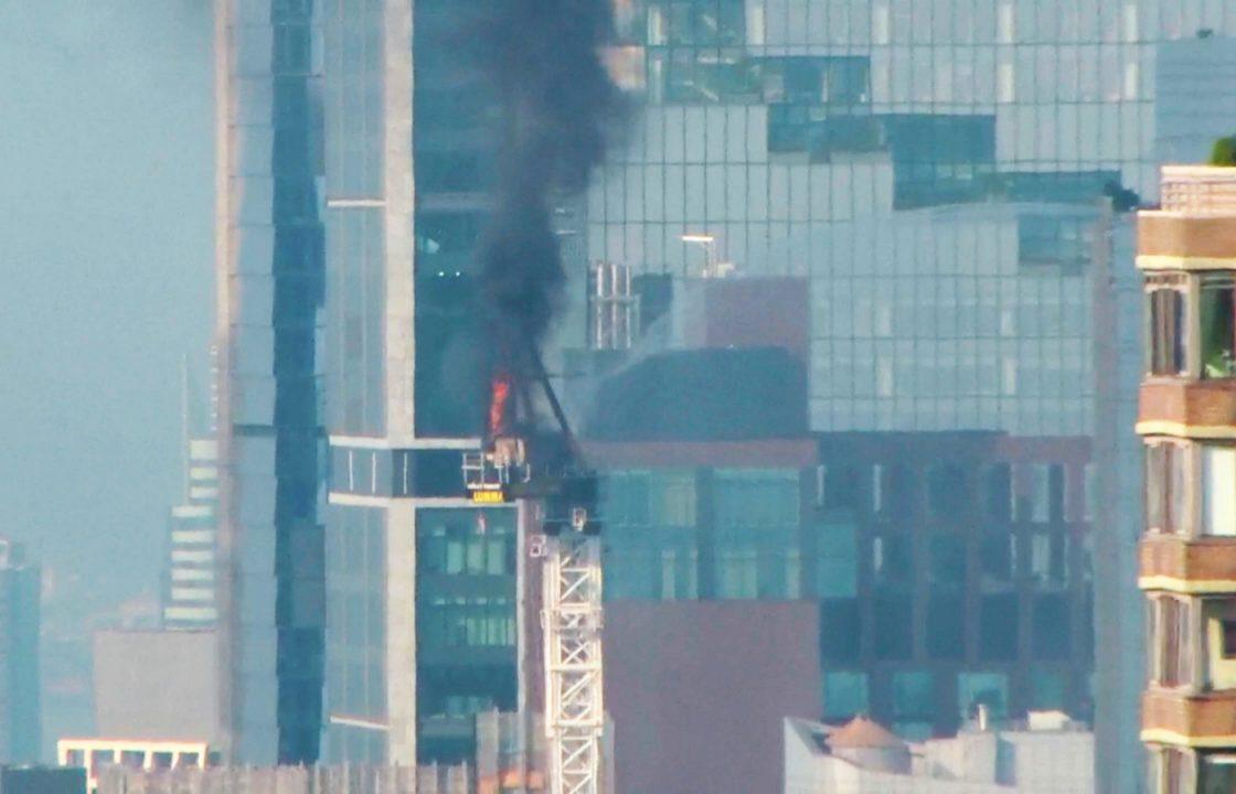 Pedestrians scatter as fire causes New York crane arm to crash to street