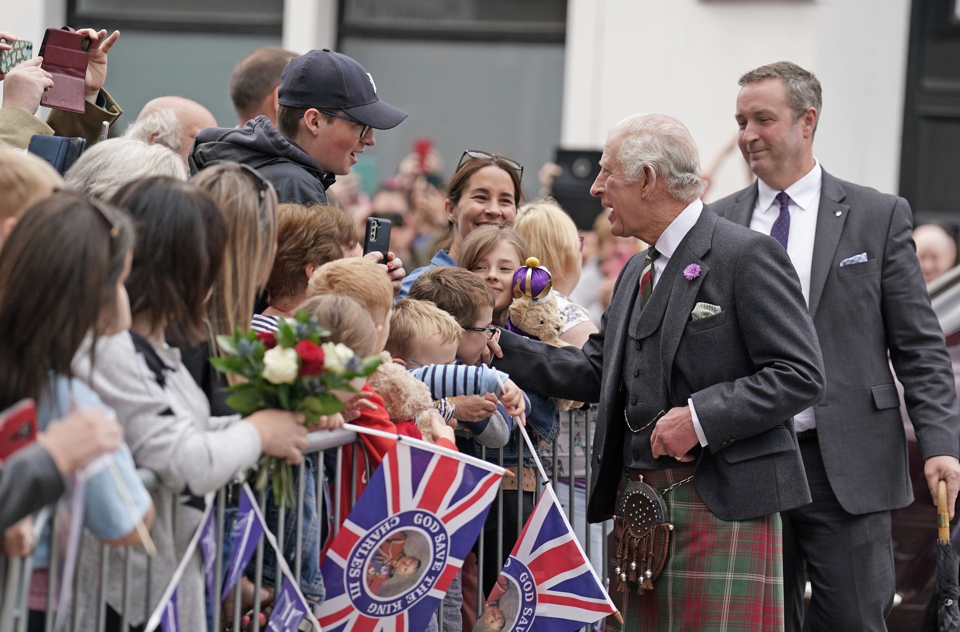 Crowds lined the street to meet the King and Queen (Andrew Milligan/PA)
