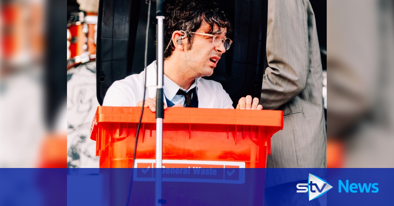 The 1975 frontman Matty Healy arrives in red wheelie bin to perform TRNSMT set