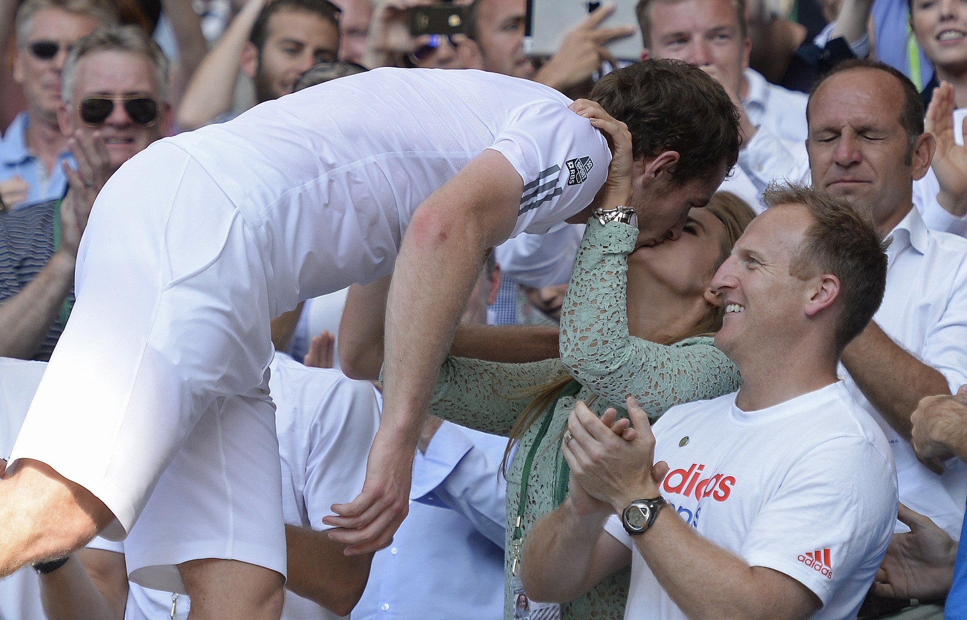 Murray kissing then-girlfriend Kim Sears in the players box after winning the Wimbledon final.