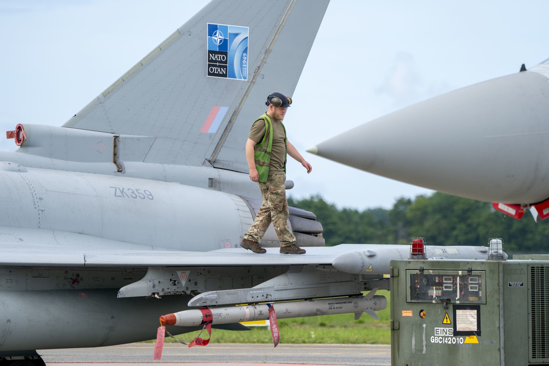 A member of the ground crew checks an RAF Typhoon jet after its return from exercise Jousten Strike at the Amari Airbase in Estonia.
