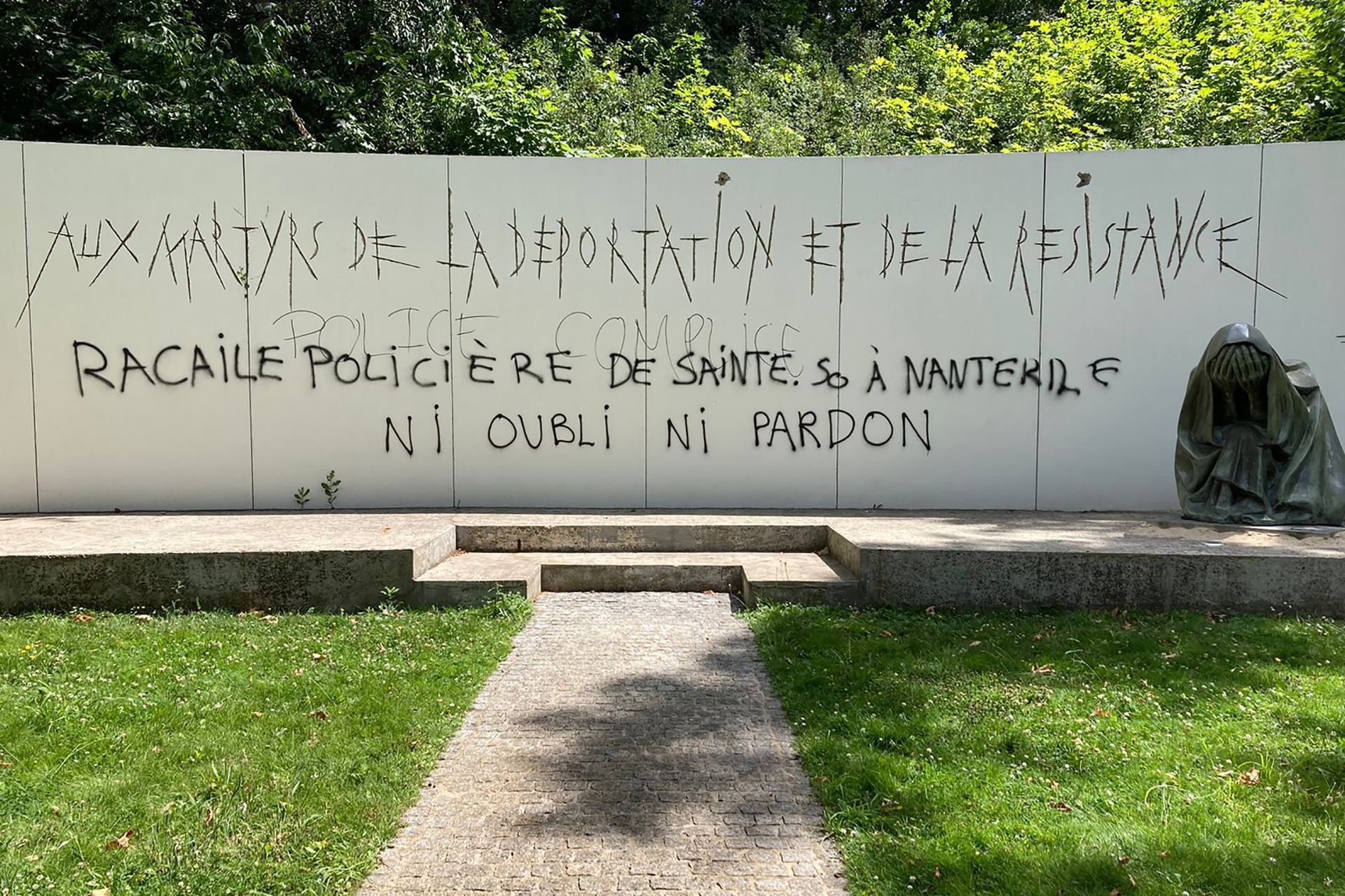 A graffiti reading ‘Police scum from Saint-Soline to Nanterre – do not forget or forgive’ on a Holocaust memorial in Nanterre.