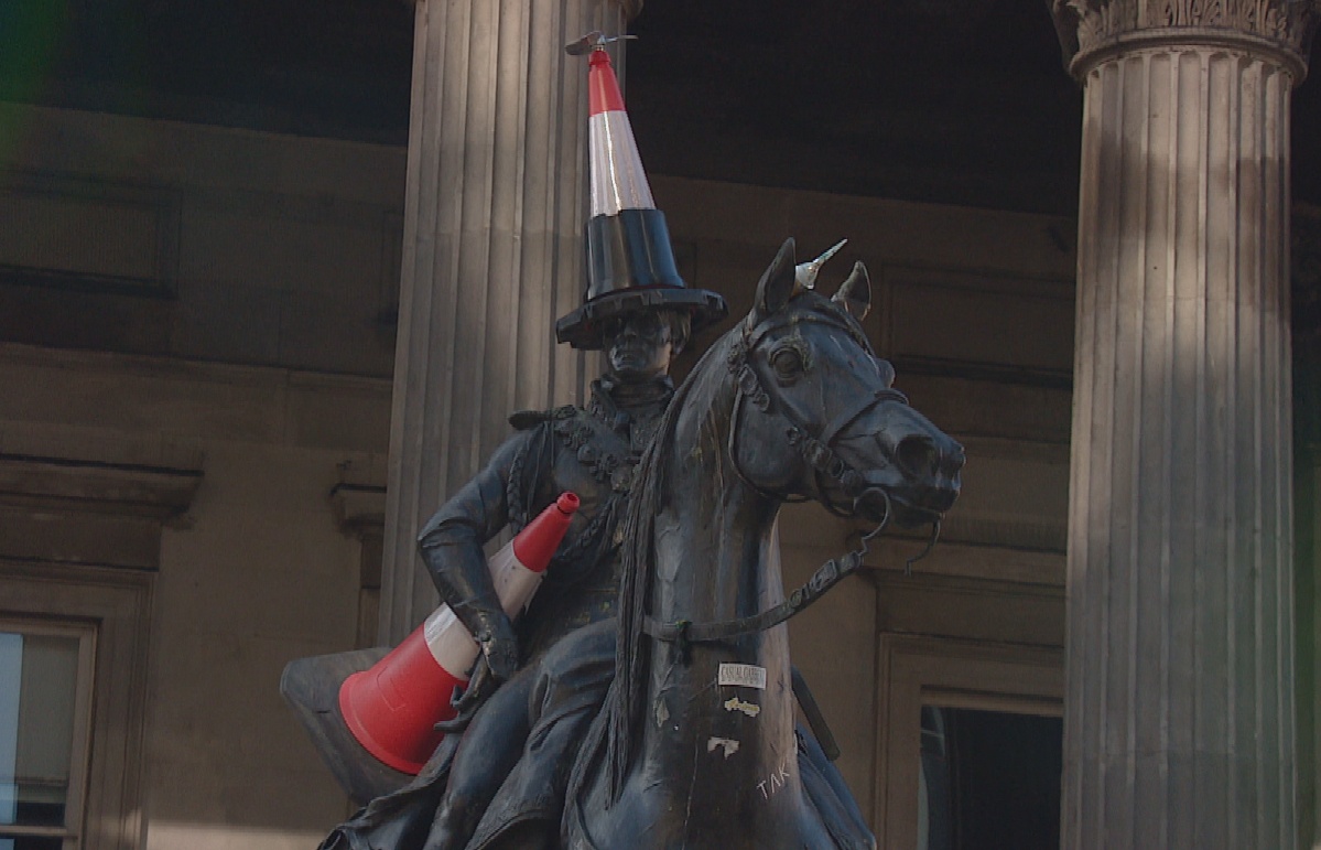 The Duke is now sporting a brand new cone-hat - with a black bottom half and a propeller on top - alongside another cone placed under his arm.