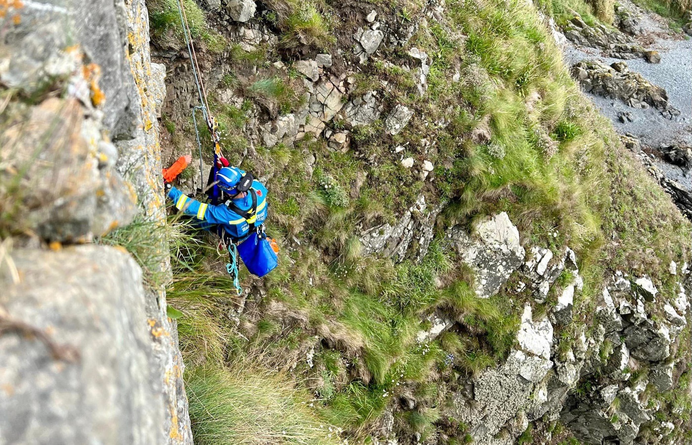 Two people had gone over the cliff to rescue the dog when one man became stuck prompting the rescue operation.