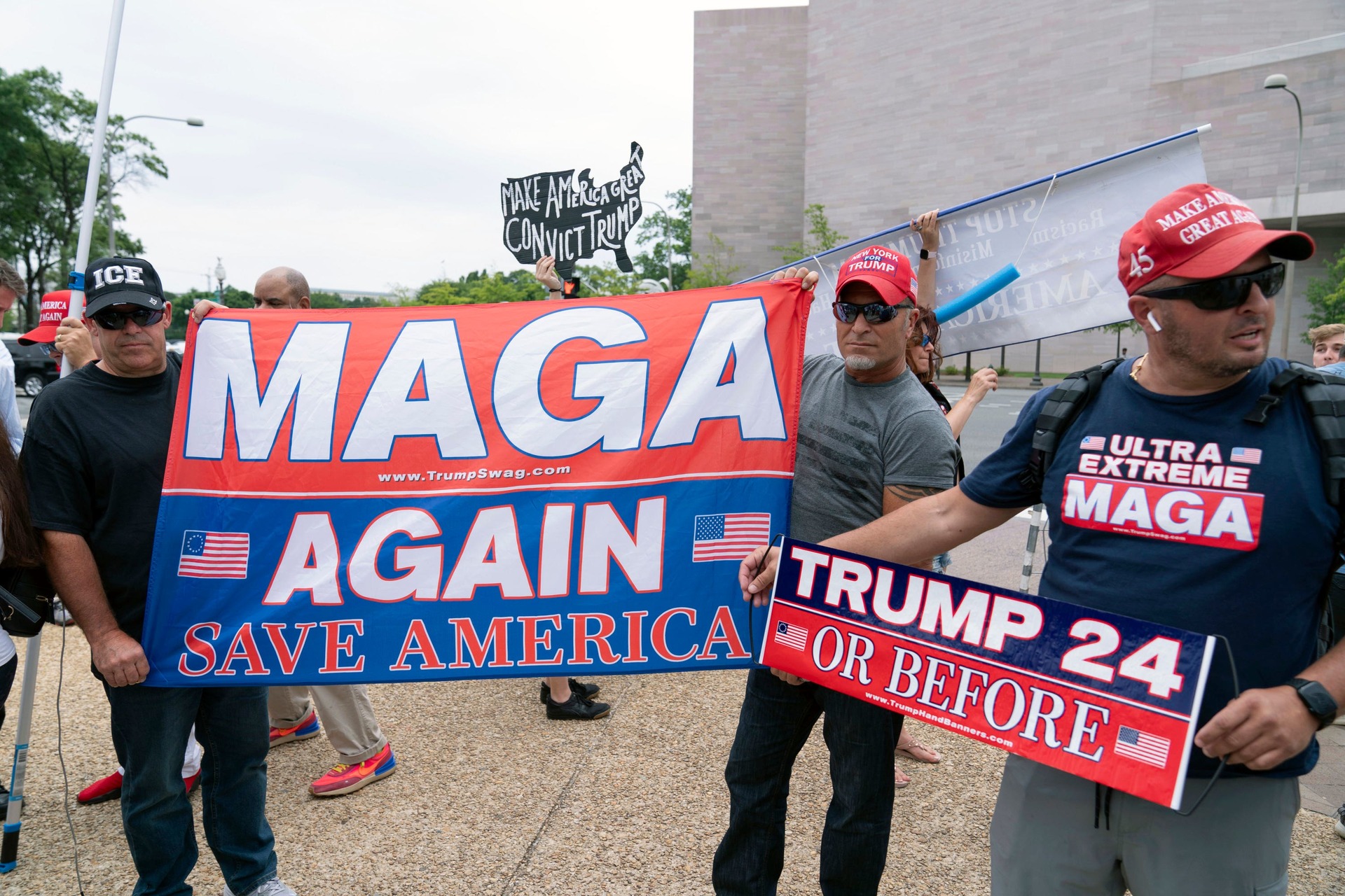 Supporters of Donald Trump gather outside court.