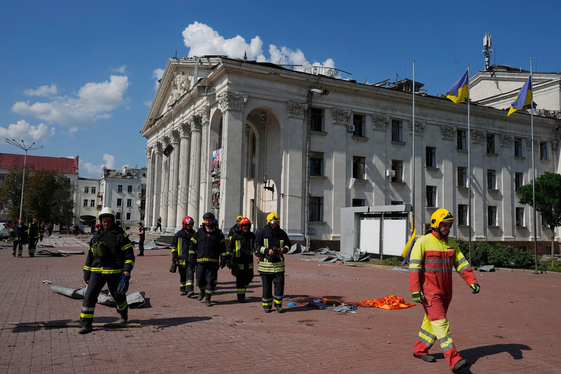 Firefighters near damaged buildings in Chernihiv, Ukraine.