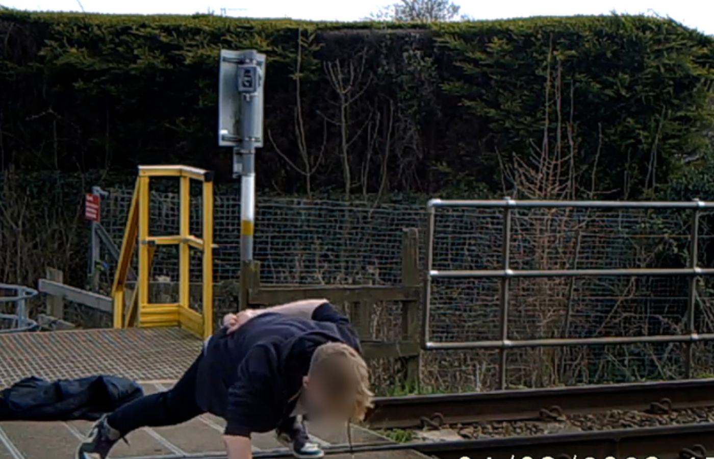 One clip shows a male doing push ups on the tracks. 