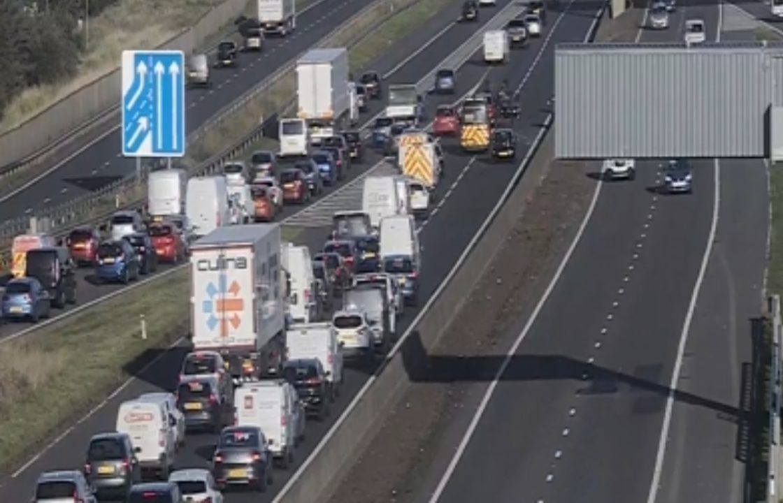 Overturned car forces M8 closure during rush hour traffic