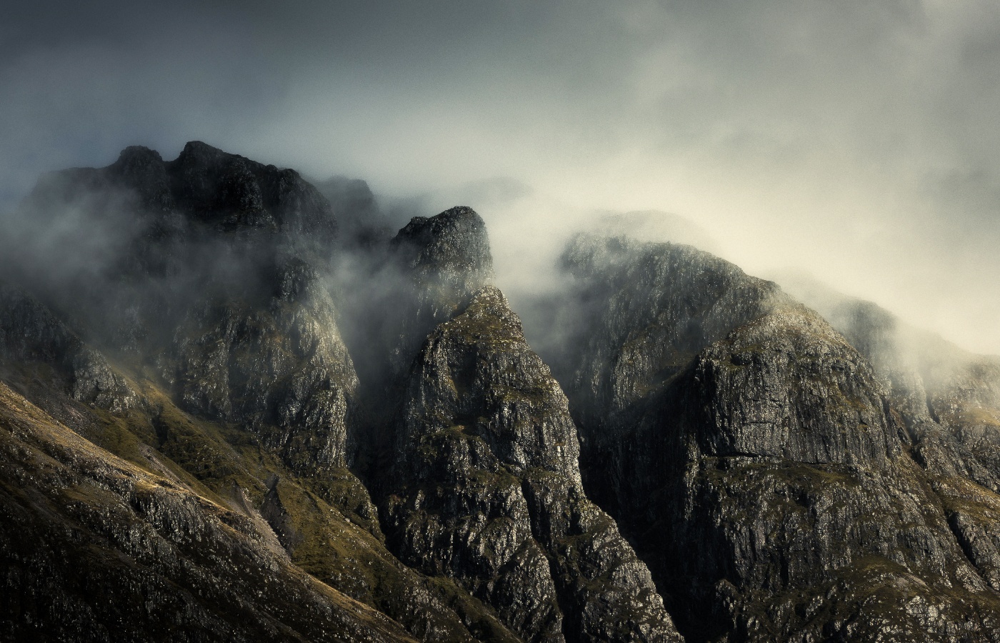 The rugged treacherous mist covered ridges, gullies and peaks of the Aonach Eagach Ridge.