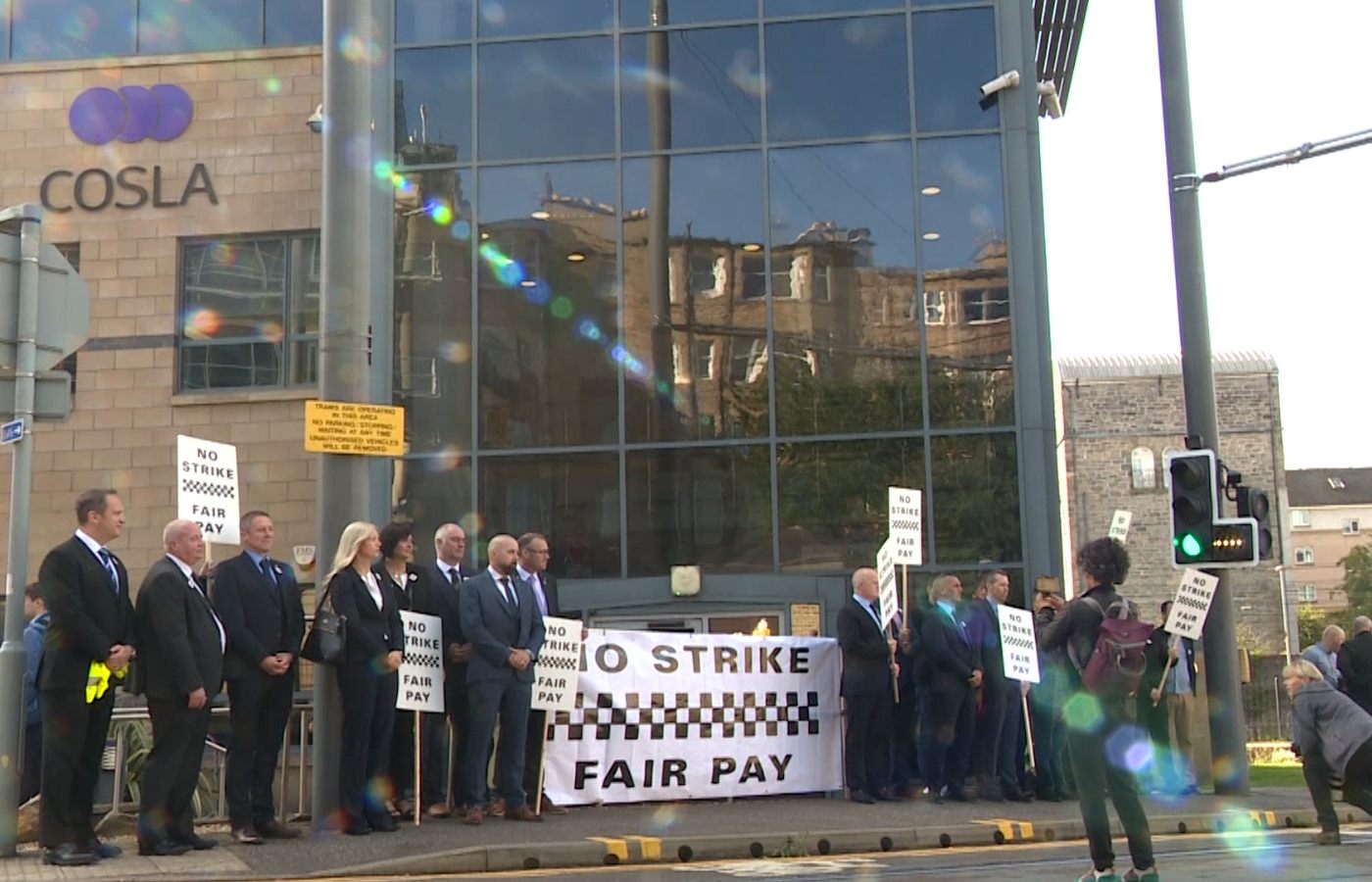 Police officers protested outside the COSLA building in Edinburgh.