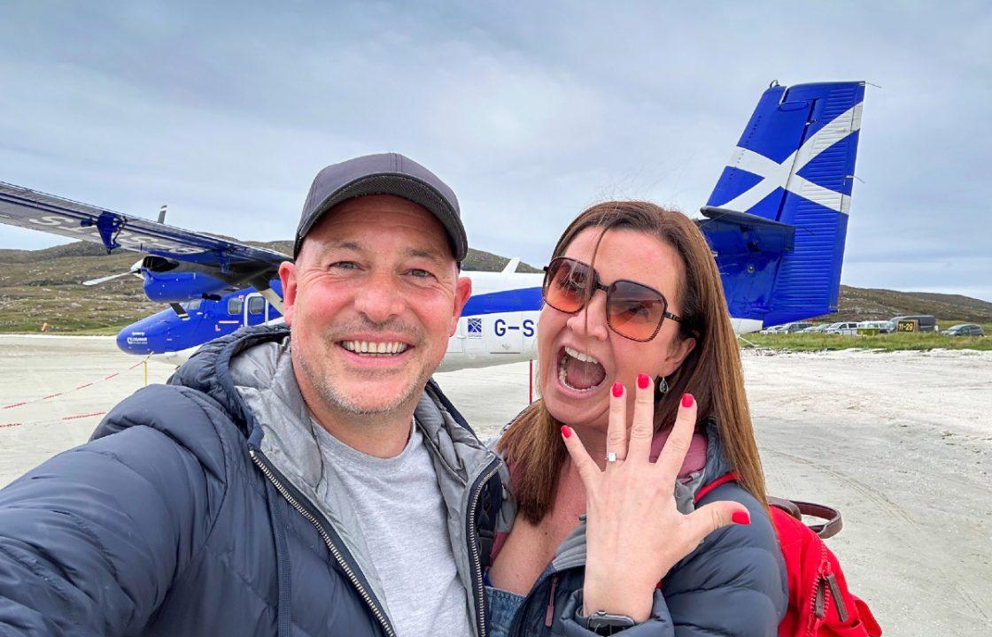 Couple get engaged in the sky as proposal etched on world-famous Barra beach