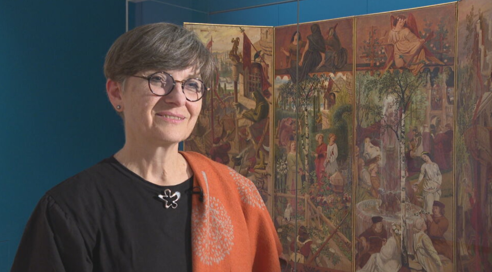 Dr Tricia Allerston discusses the King's Quair screen, on display for the first time since the 1960s