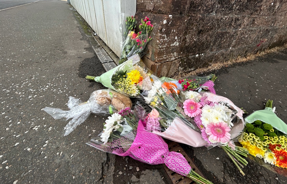 Floral tributes have been left on the A76.