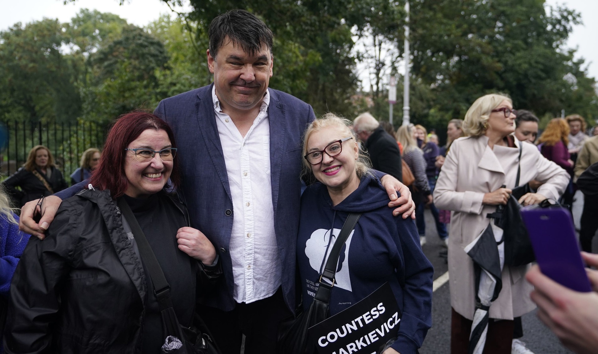 Graham Linehan takes selfies with protesters at a Let Women Speak rally at Merrion Square in Dublin.