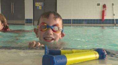 Montrose boy with cerebral palsy defies odds by learning to swim a year after spinal surgery