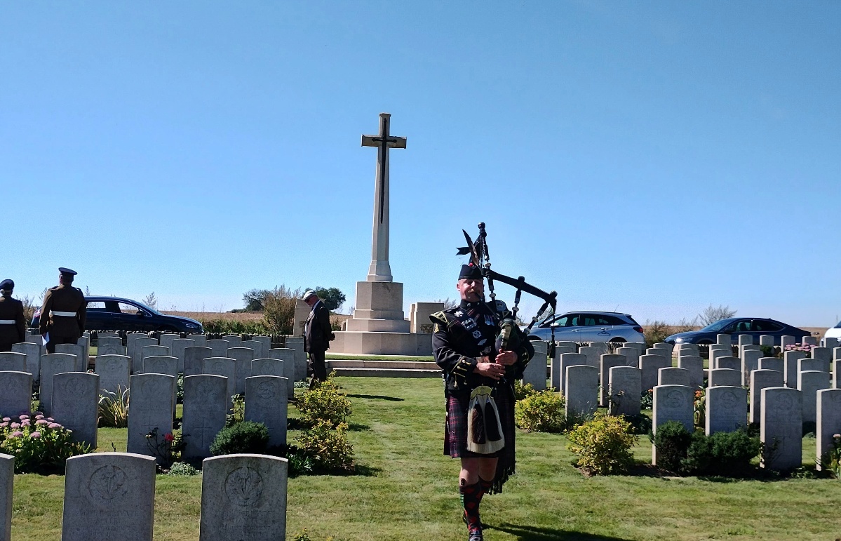 Piper Jamie Killorn plays the Lament during the rededication service for Pte Little at Raperie British Cemetery (MOD/PA).