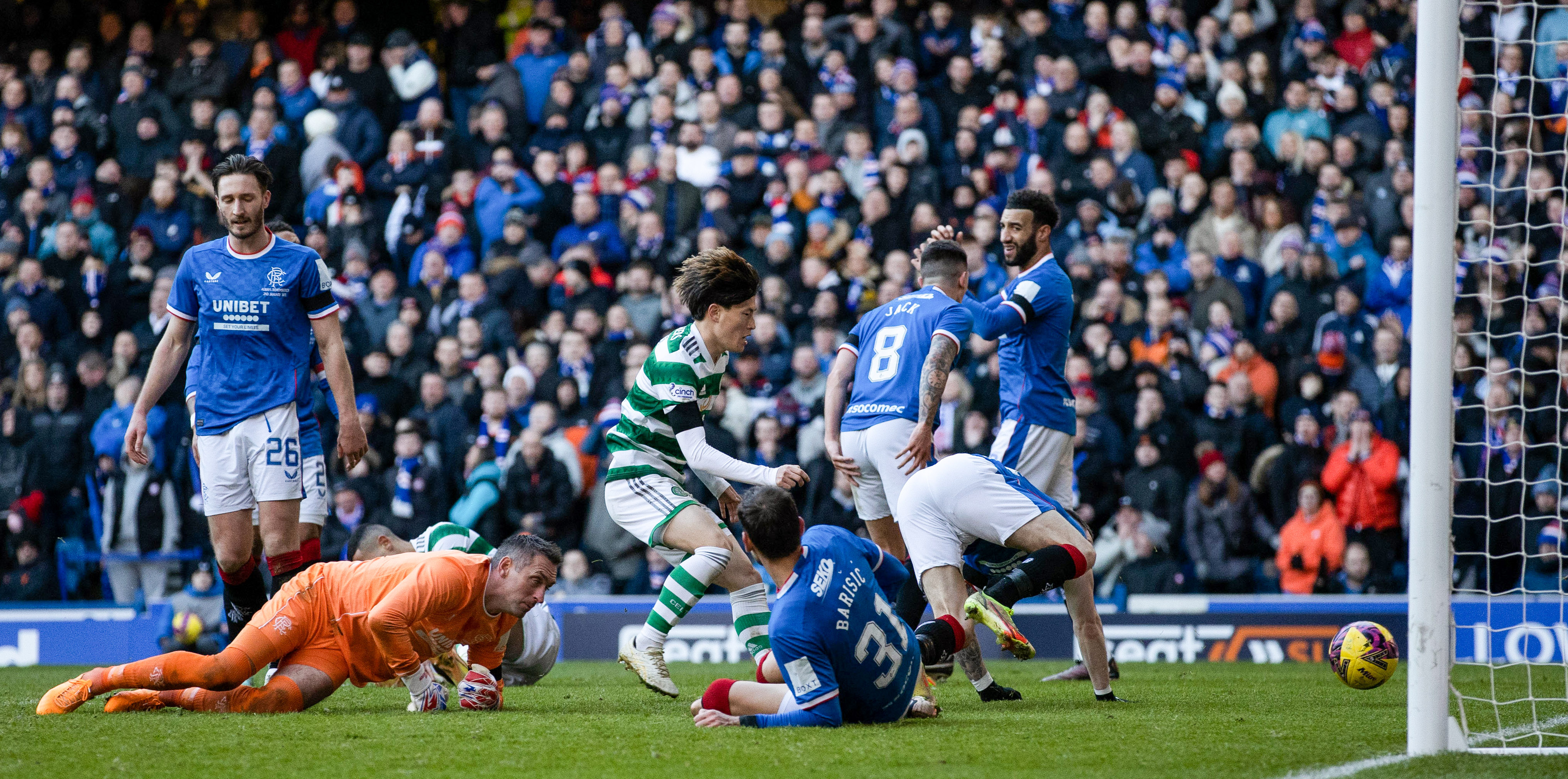 Celtic's Kyogo Furuhashi runs to collect the ball after scoring a late equaliser to make it 2-2 during a cinch Premiership match between Rangers and Celtic at Ibrox Stadium, on January 2, 2023.