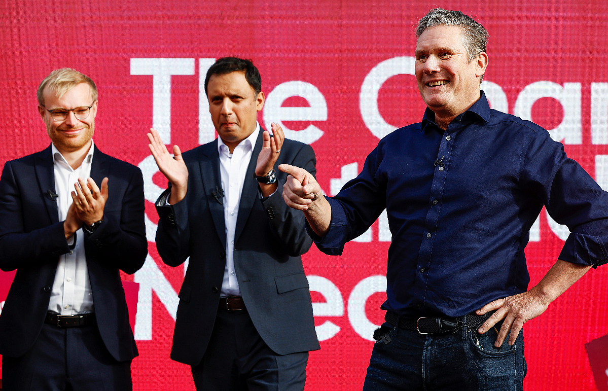 Labour Party leader Keir Starmer (R) joined Scottish Labour leader Anas Sarwar (C) and MP-elect Michael Shanks (L) to celebrate Shanks' victory in the Rutherglen and Hamilton West by-election on October 6.