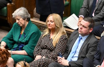 Ex-SNP MP Lisa Cameron crosses floor to Tory benches flanked by Theresa May and Douglas Ross