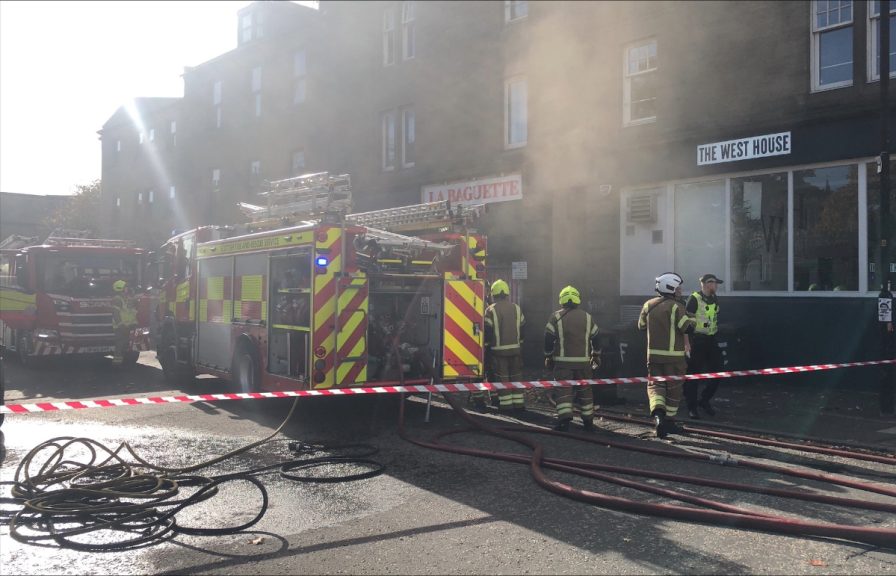Three people treated for smoke inhalation as fire crews tackle blaze at ...