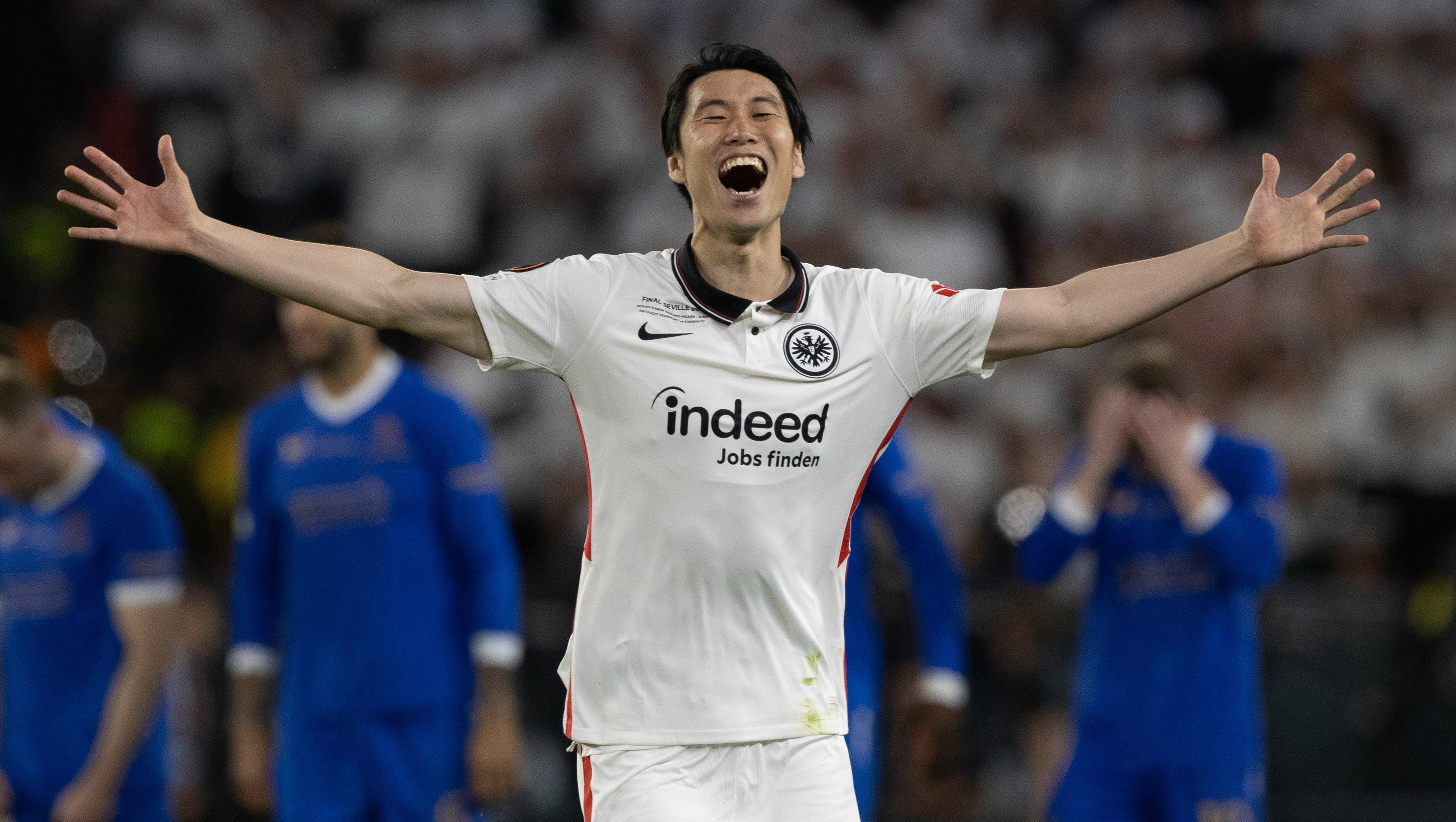 Frankfurt's Daichi Kamada celebrates after Frankfurt win the Europa League during the UEFA Europa League Final between Eintracht Frankfurt v Rangers at the Ramon Sanchez Pizjuan Stadium, on May 18, 2022.