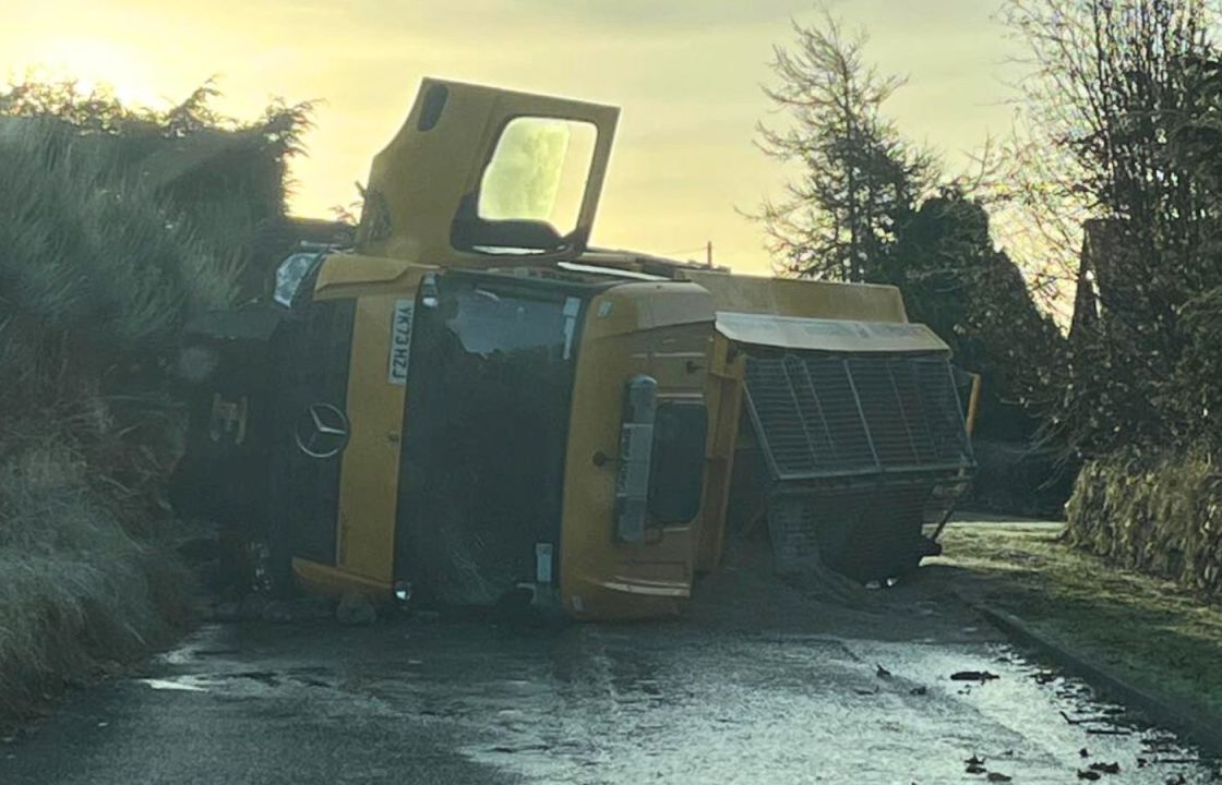 Gritter overturns after skidding on frozen floodwater amid ice warning following Storm Babet