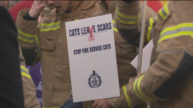 Firefighters protest at Holyrood over budget cuts to service