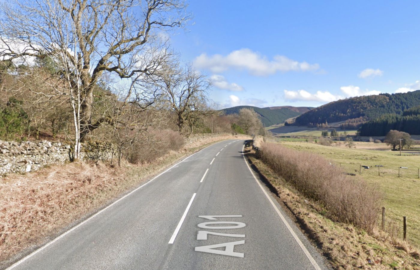 Man 62 taken to Glasgow hospital after motorbike crash on A701 in